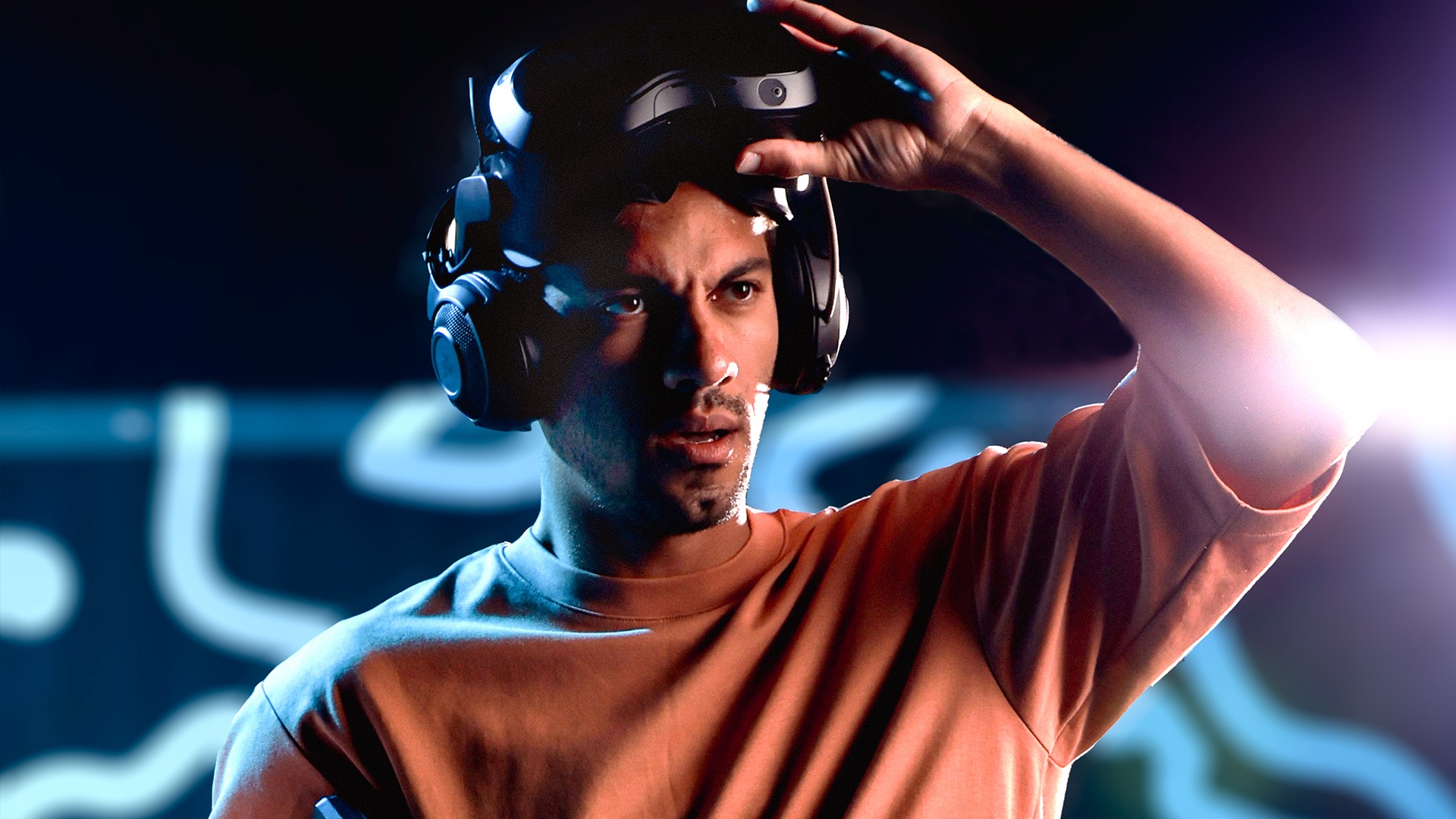A Zero Latency VR guest lifting a headset with a surprised expression