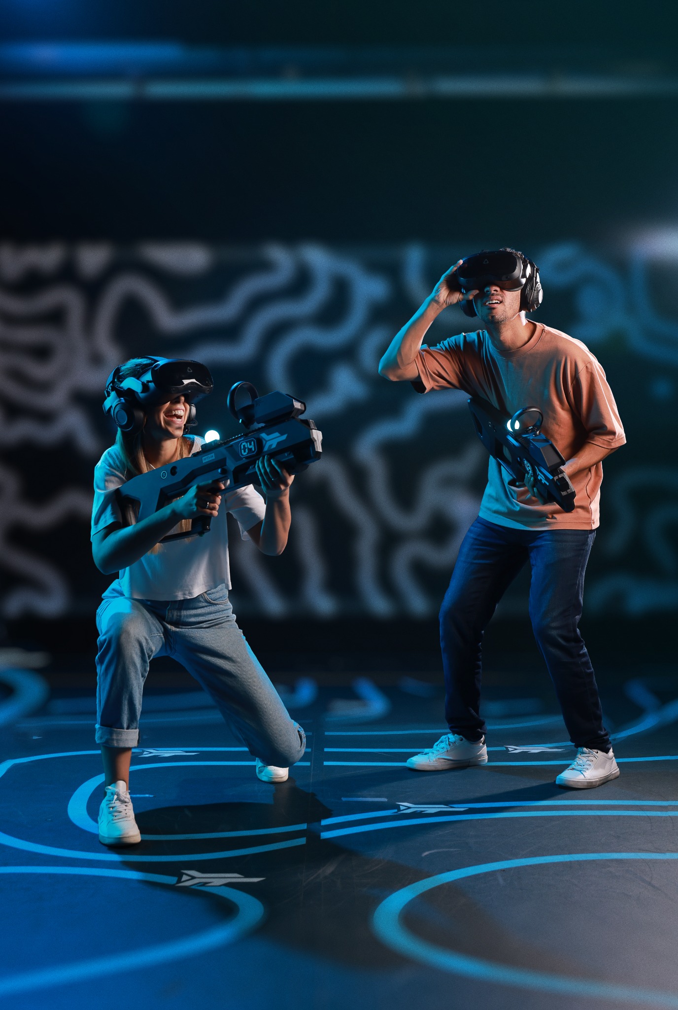 Zero Latency VR guest laughing while lifting a headset