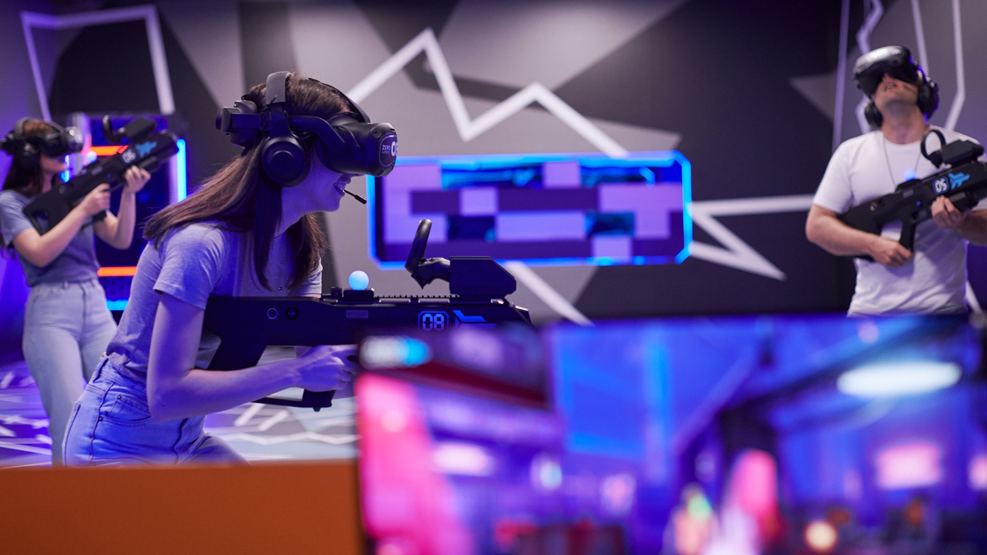 Zero Latency VR players in the arena with a Game Master nearby